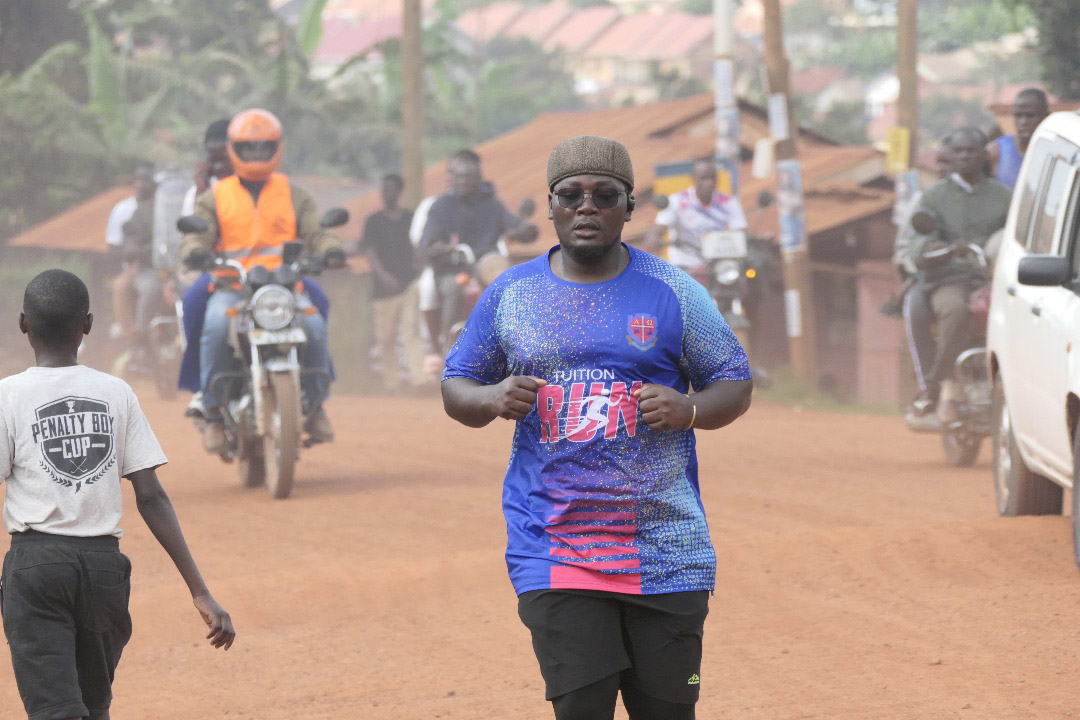 One of the participants pushes toward the finish line during the UCU Tuition Run 2025, showing determination to support students struggling with tuition. (Credit: UCU)