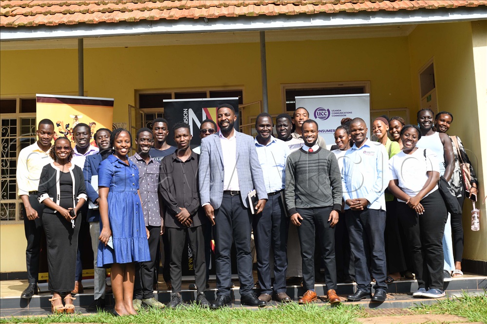 UCU students joined Vision Group Max Adii and UCC Regional Manager Emmanuel Muyomba in a group picture.