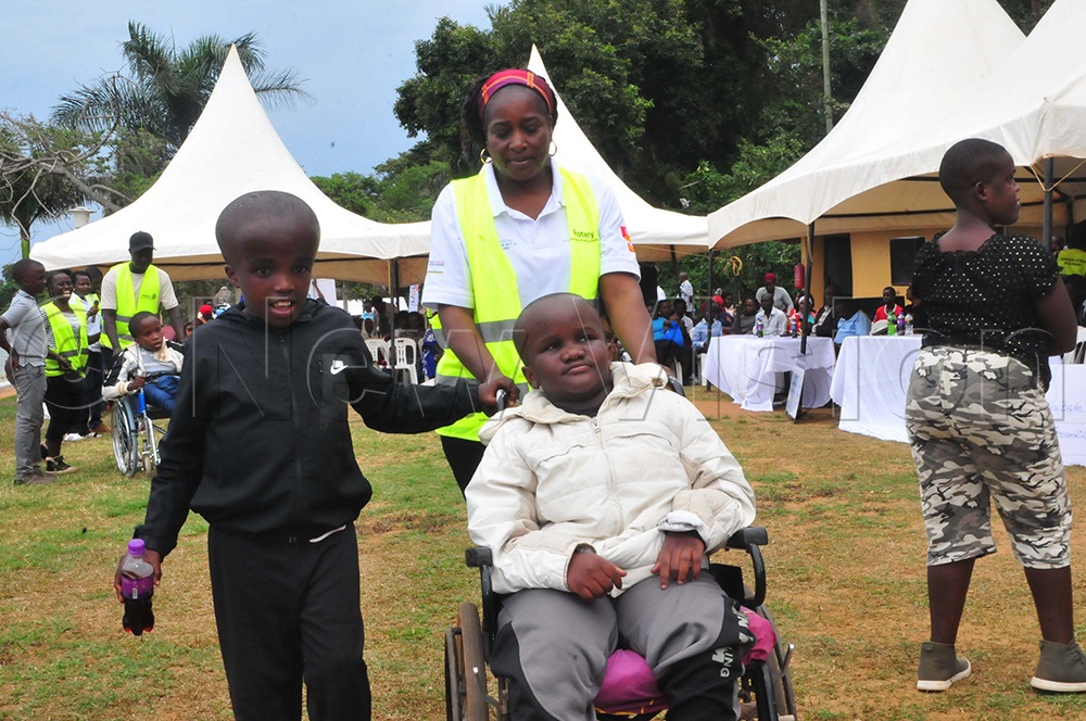Cynthia Baitwa, patron of the Hydrocephalus and Spina Bifida Association of Uganda, with some of the children during celebrations to mark the day of Hydrocephalus and spina bifida in Entebbe on Sept. 23, 2025. (Photo by Nicholas Oneal)