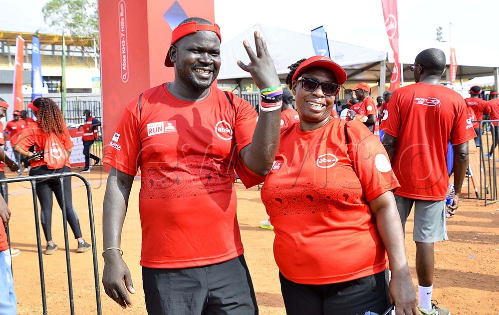 David Olim interacts with Lillian Kamanzi Mugisha, AMREF Health Africa Uganda head of Communications and Fundraising during the 2026 Absa KH3-7 Hills Run held at Lugogo Millenium Grounds on May 17th 2026. (Credit: Juliet Kasirye)
