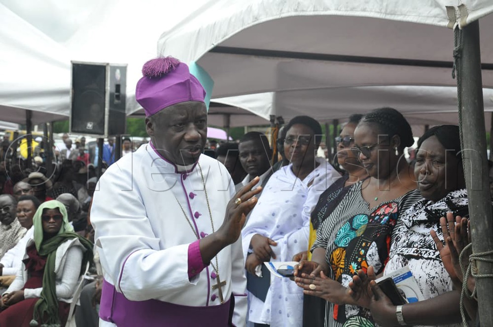 ishop of West Ankole Diocese, Johnson Twinomujuni greeting mourners at the venue. (Photo by Bruno Mugizi)