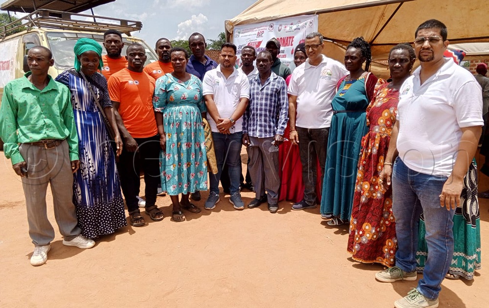 Members of North India Cultural Association with residents of Tokekulu in Luwero district during a recent medical camp. (Credit: Nelson Kiva)