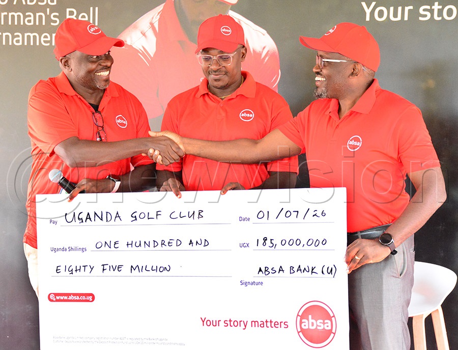 Absa Managing Director David Wandera (right) exchanges pleasntries with UGC Captain Brian Rwaboogo (left) and chairman Paul Nuwagaba as he hands over a sh185m cheque for the Chairman's Bell Tournament, at Kitante, July 1, 2026. Photo by Michael Nsubuga