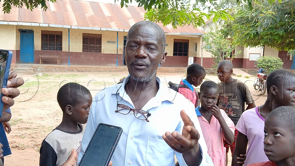 David Ndiope, the teacher who had gone to the staffroom to pick his spectacles to mark the English exercise narrating what happened. (Photo by Jackie Nambogga)