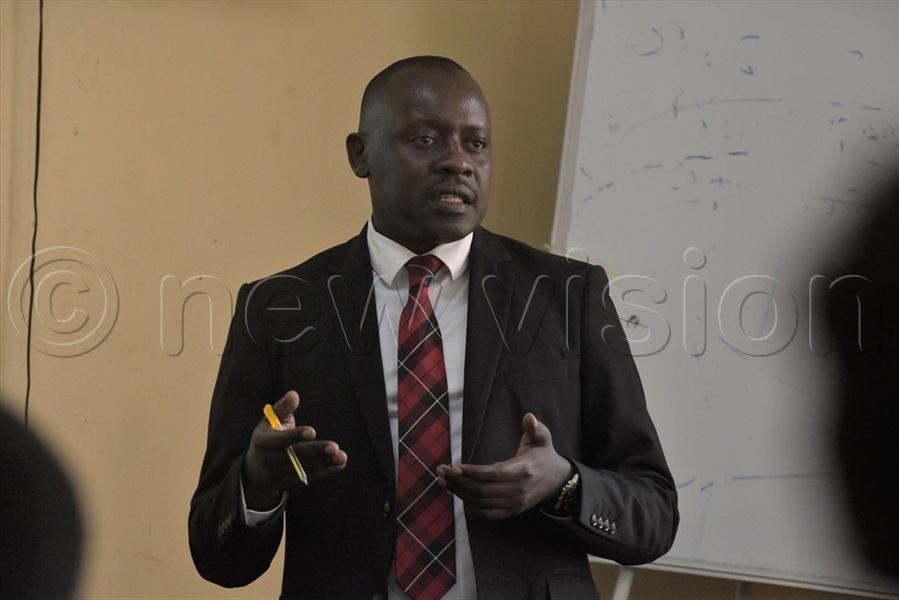 Rogers Golooba, the Senior Probation and Welfare Officer, MGLSD, addressing stakeholders in Jinja.