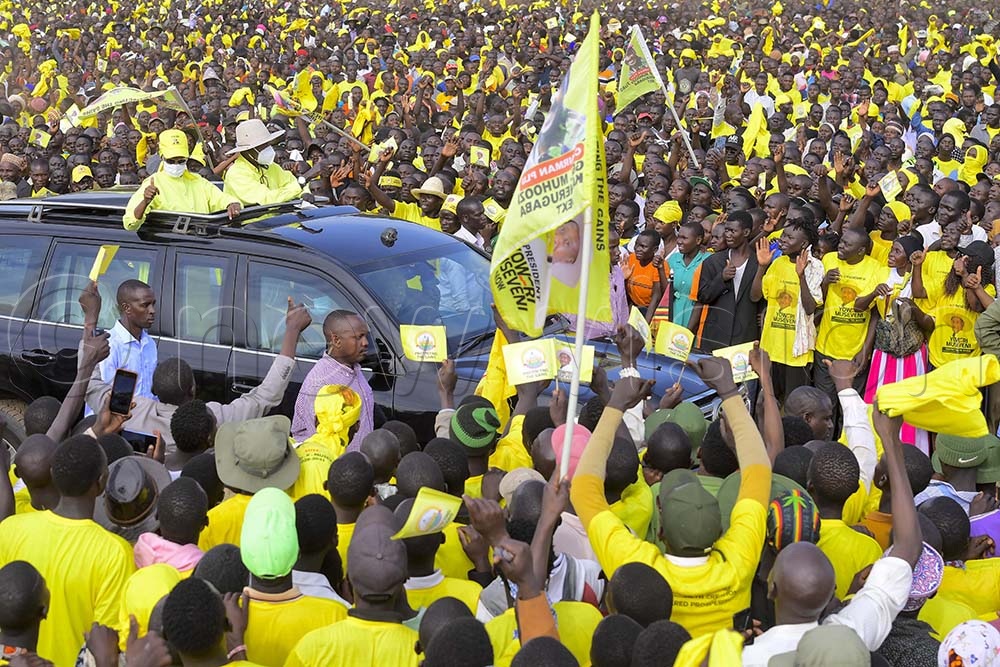 Museveni accompanied by the First Lady at one of his Campaign rallies.