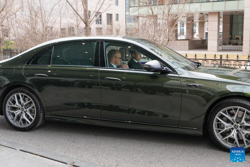 German Chancellor Friedrich Merz is pictured during a test ride on a new generation S-Class vehicle of Mercedes Benz to experience an urban and highway pilot driver-assist system, co-developed by Mercedes-Benz and Chinese tech firm Momenta, in Beijing, capital of China, February 26, 2026. (Xinhua Photo)