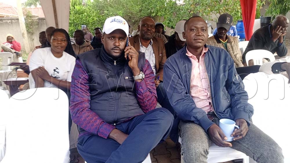 Denis Onekalit Amere wearing white cap seated at EC tally centre as he waited to be declared the two-time MP for Kitgum Municipality after he defeated minister Beatrice Atim Anywr. (Credit: Christopher Nyeko)