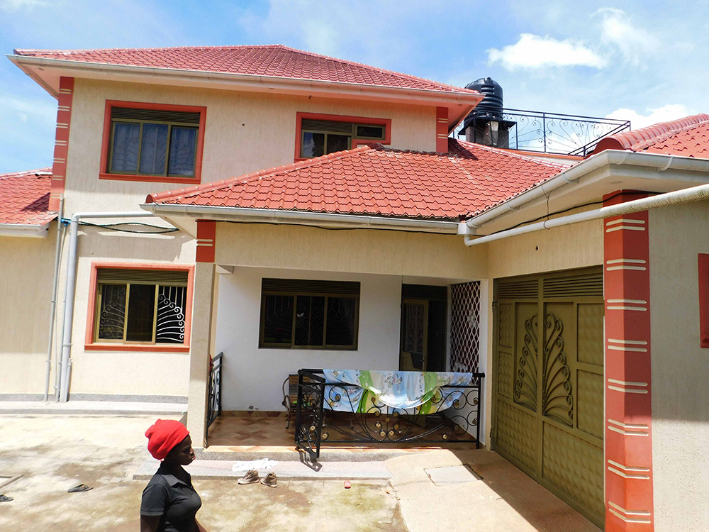 Construction expert Muhammad Nsereko advises homeowners to inspect the strength of walls, timber and other structural elements before removing an existing roof. (File photo)