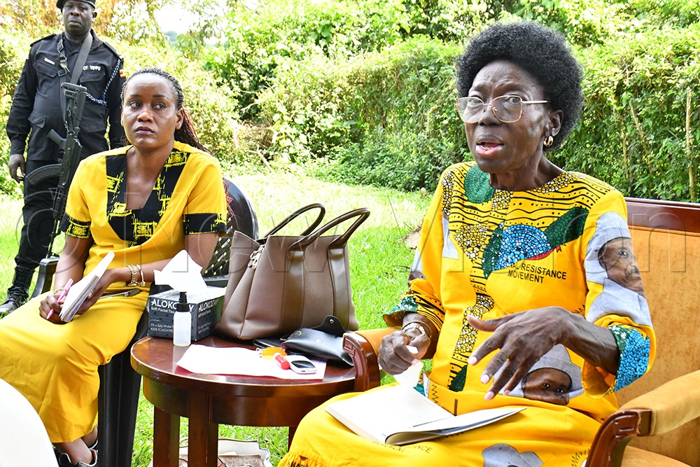 First Deputy Prime Minister and Minister for East African Community Affairs, Rebecca Alitwala Kadaga (right), addressing members of the Presidential Task Force of Busoga sub-region at her country home in Mbulamuti, Kamuli district, on Saturday. Looking on is Busoga Tourism Minister Hellen Namutamba (left). (Photo by Donald Kiirya)