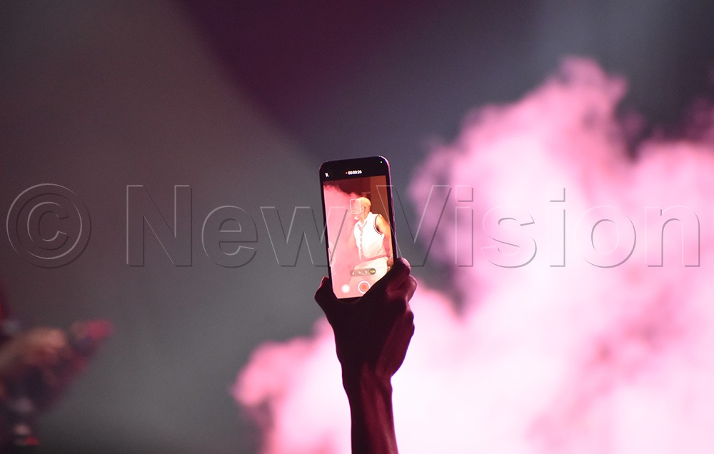 See Awilo through a fan's phone camera. (Credit: