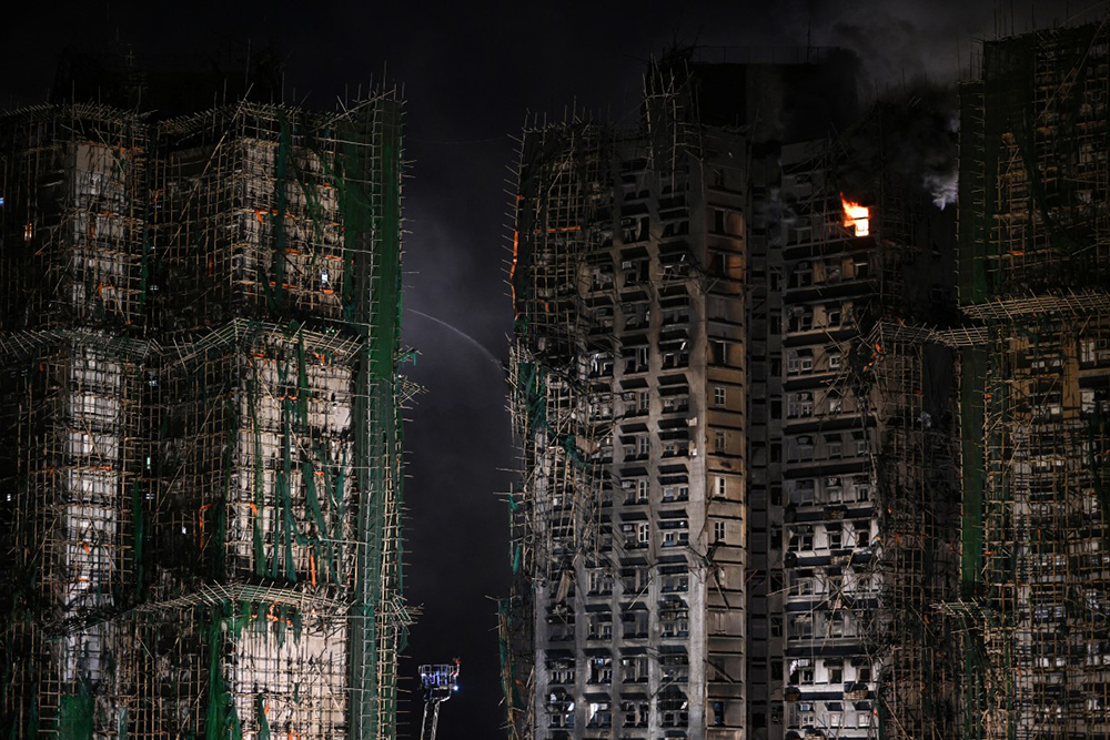 A general view shows the aftermath of a major fire that swept through several apartment blocks at the Wang Fuk Court residential estate in Hong Kong's Tai Po district on November 27, 2025. 