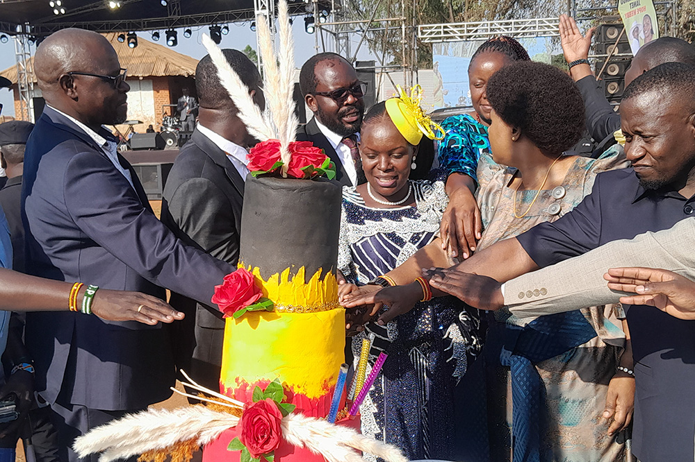 Cake time. Barbara Nekesa Oundo and Janet Anyango Webie cutting cake. (Photo by Egessa Hajusu)