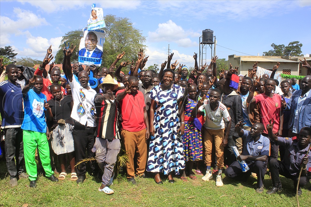 Forum for Democratic Change (FDC) new recruits pose for a group pic with FDC candidates for Kwania Woman Mp Kate Etit Okao.