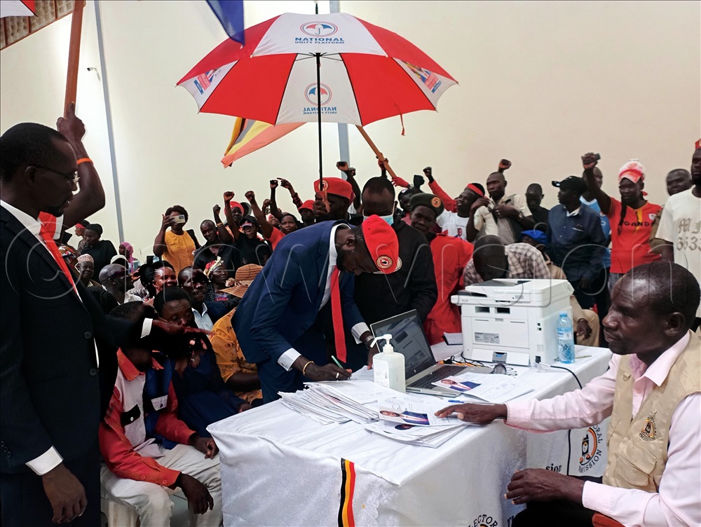 NUP's Yassa Kato signing after his nomination.