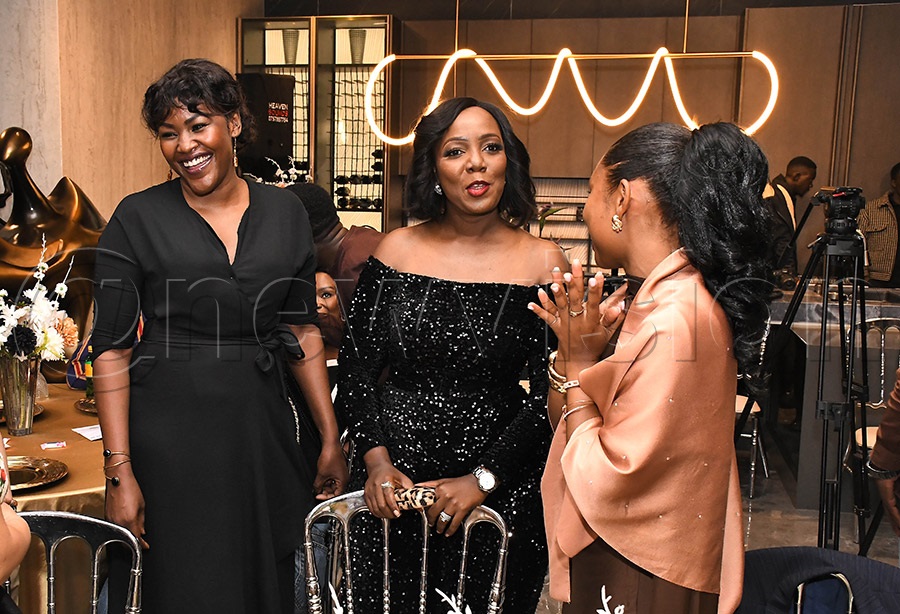 Brenda Nanyonjo (center) and former Miss Uganda Phiona Bizzu (left) share a light moment with guests during the launch of Miss Uganda 2026. Photo by Ignatius Kamya
