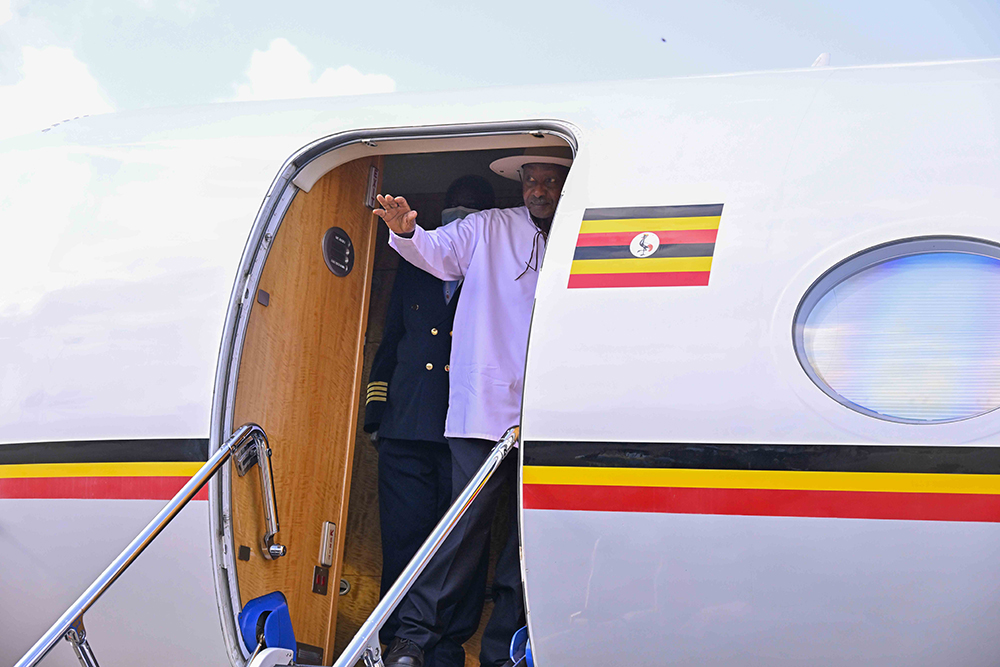 President Museveni emerging from the presidential jet. (PPU)