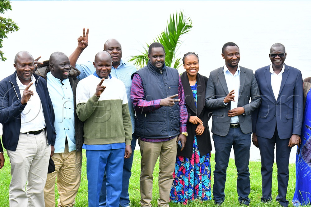 FDC Party president Patrick Oboi Amuriat (right) and FDC Party chairman Nathan Nandala Mafabi (left) in a group photograph during a retreat at Mountain Inn at Kiyindi landing site in Buikwe district on May 10th.  (Photo by Donald Kiirya)