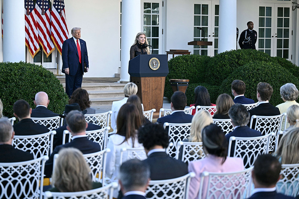 US President Donald Trump and Erika Kirk, Charlie Kirk's widow, participate in a Medal of Freedom Ceremony for late US right-wing activist Charlie Kirk in the Rose Garden of the White House in Washington, DC, on October 14, 2025.