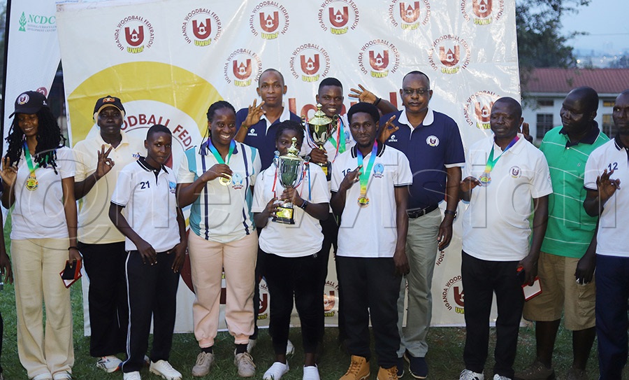 Winners at the Corporate Woodball Circuit pose for a photo with Uganda Woodball Federation President Paul Mark Kayongo at Kyambogo. Photo: Johnson Were