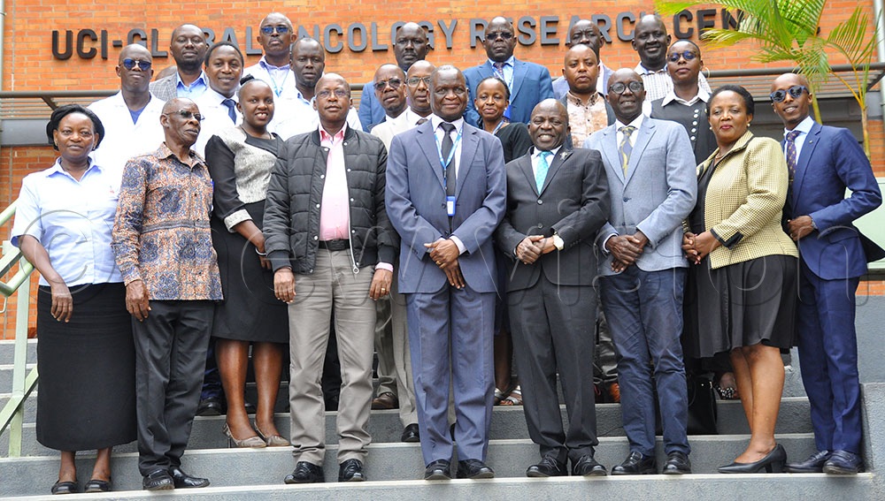 Jackson Orem, the Executive Director Uganda Cancer Institute (center, blue suit), with officials from Burundi after a meeting at Uganda Cancer Institute on December 16, 2025. (Credit: Nancy Nanyonga) 