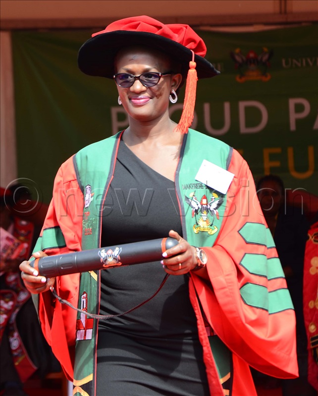 Anitah Atwijuka from the College of Humanities and Social Sciences celebrates her success after receiving a PHD in social studies during the final session of the 75th graduation ceremony at Makerere University on Friday, January 17, 2025. 