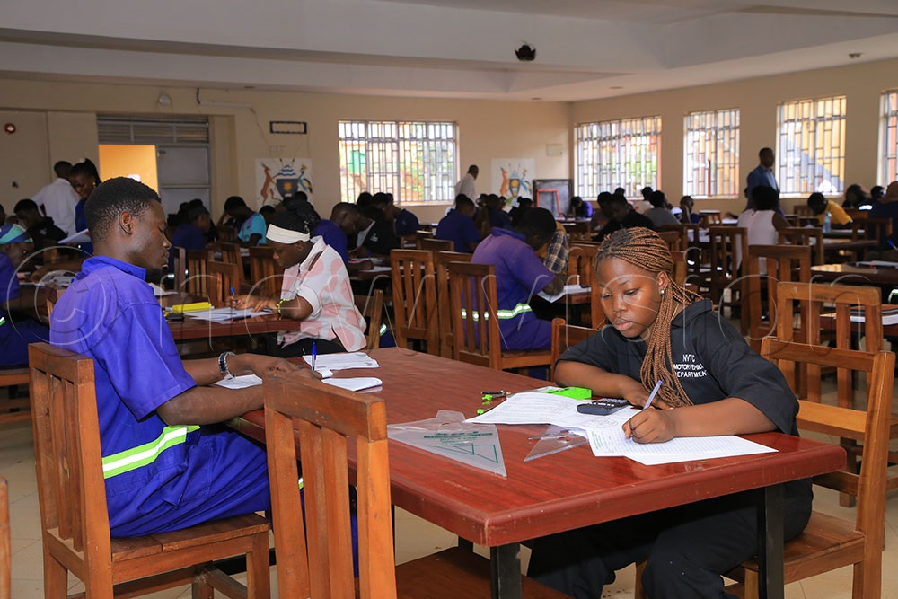 Students at Nakawa Vocational Training College writing their Automotive Fitting and Fabrication Theory and Steel Bending and Fitting Theory Exams on 11th August. (Photo by Miriam Najjingo)