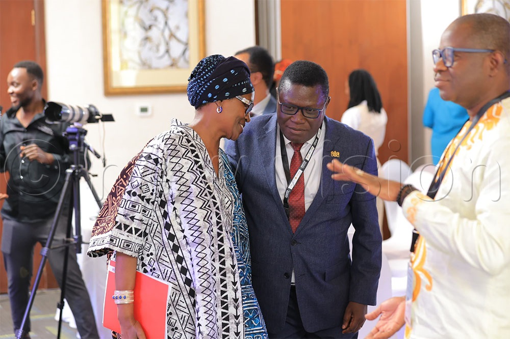 Justice minister Nobert Mao and UNAIDS executive director Winnie Byanyima interacting during the 3rd Annual Reproductive Justice Litigation Baraza. (Photo by Agnes Kyotalengerire)