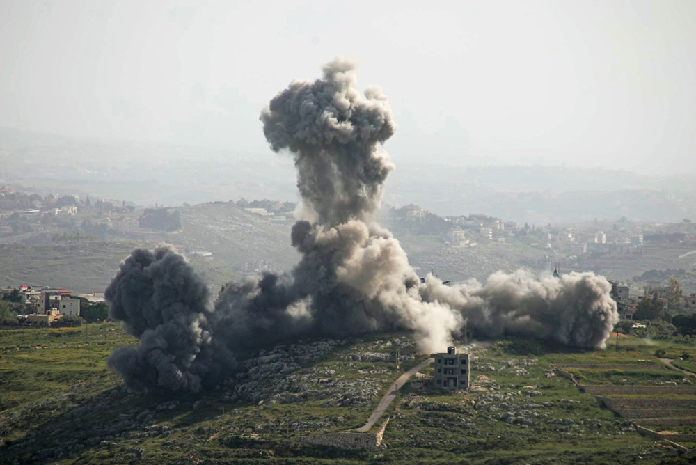 Smoke rises from the site of an Israeli airstrike that targeted the southern Lebanese village of Deir El Zahrani on May 13, 2026. Israel intensified strikes on Lebanon on May 13 with the health ministry reporting 12 people killed in attacks targeting cars, mostly south of Beirut, despite a ceasefire between Israel and Hezbollah. (Photo by Kawnat HAJU / AFP)