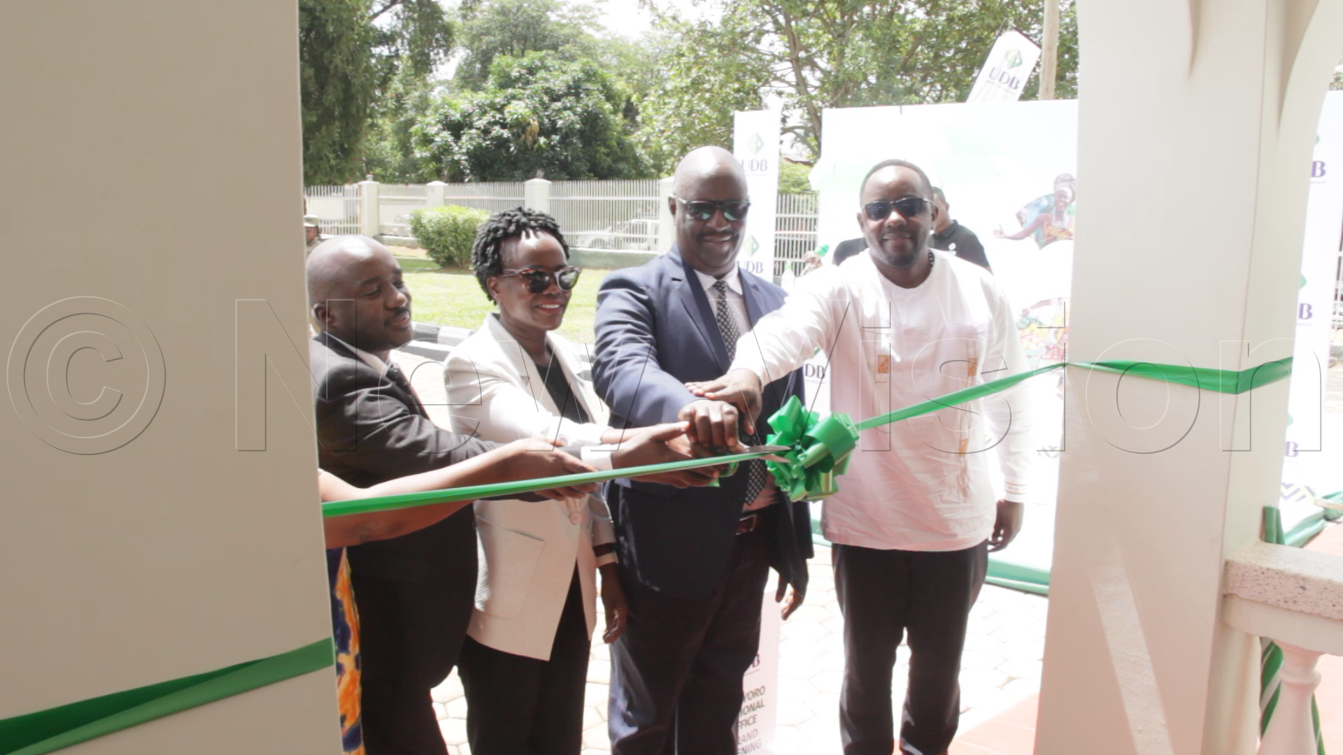 Premier Byakutaga with UDB officials at the launch of the Bunyoro regional office at Kyaruhanga road in Hoima City. (Photo by Andrew Musinguzi)
