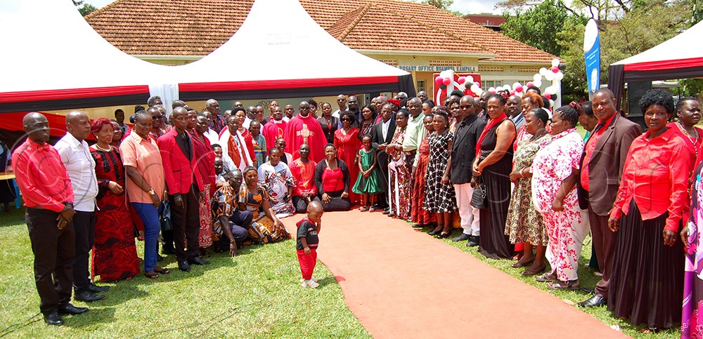 Catholic priests sharing a photo-moment with the couples that graced the celebration of St. Valentine's Day at Nsambya Catholic Parish Gardens on Saturday, February 14. (Photo by Mathias Mazinga)