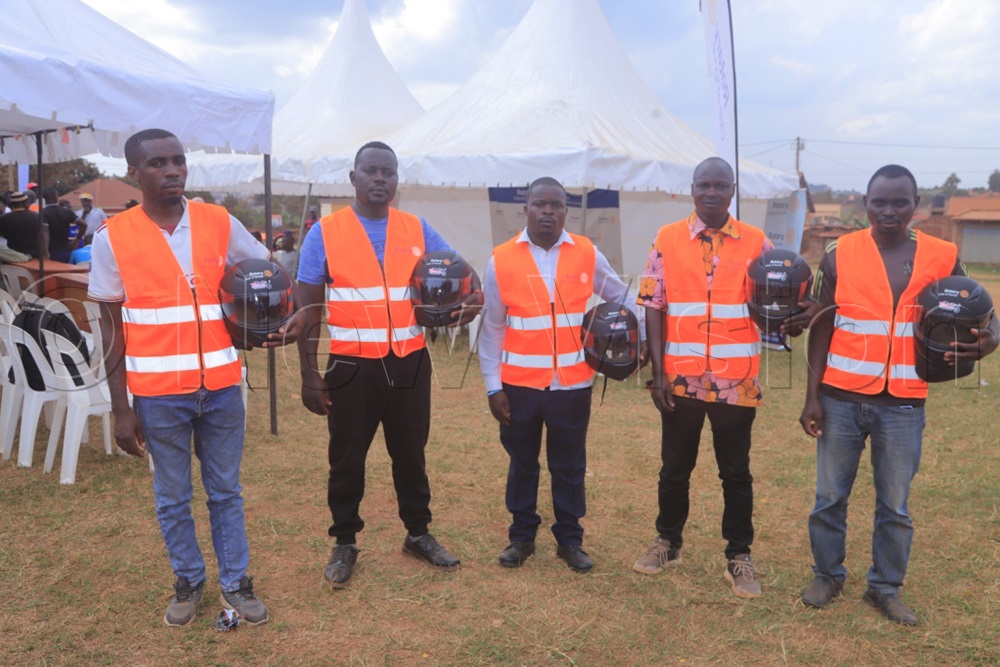 Some of the boda boda riders display the safety gear they received from the Rotary Club of Sonde during the distribution exercise. (Photo by Eric Yiga)
