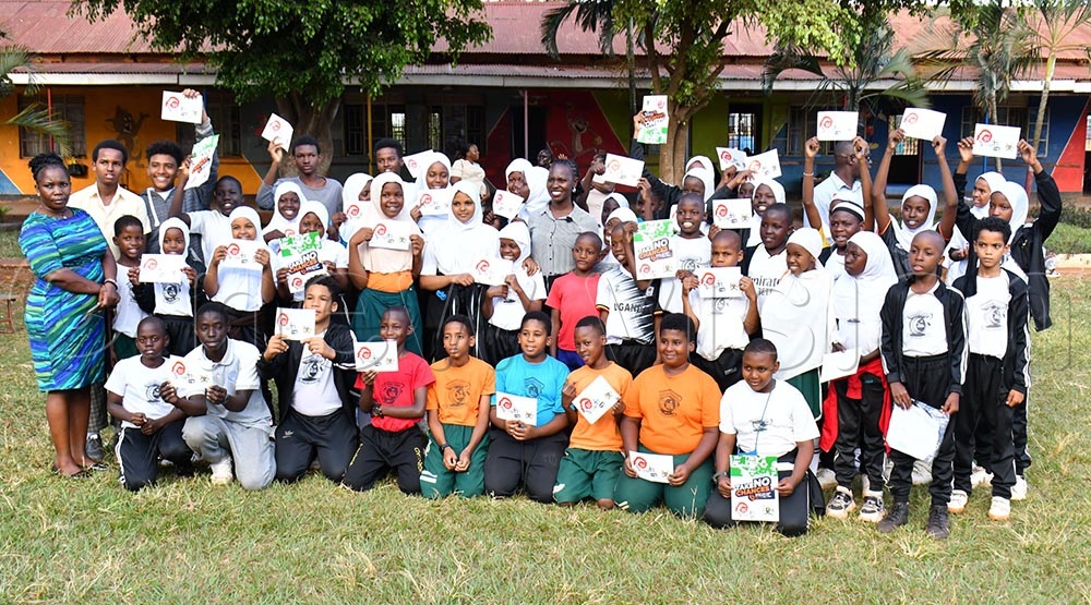 The State Minister of Youth and Children Affairs Mercy Faith Lakisa (C) in a group photograph with pupils of Primary Five of Multiple Junior School in Jinja City on July 14th, 2026. (Credit: Donald Kiirya)