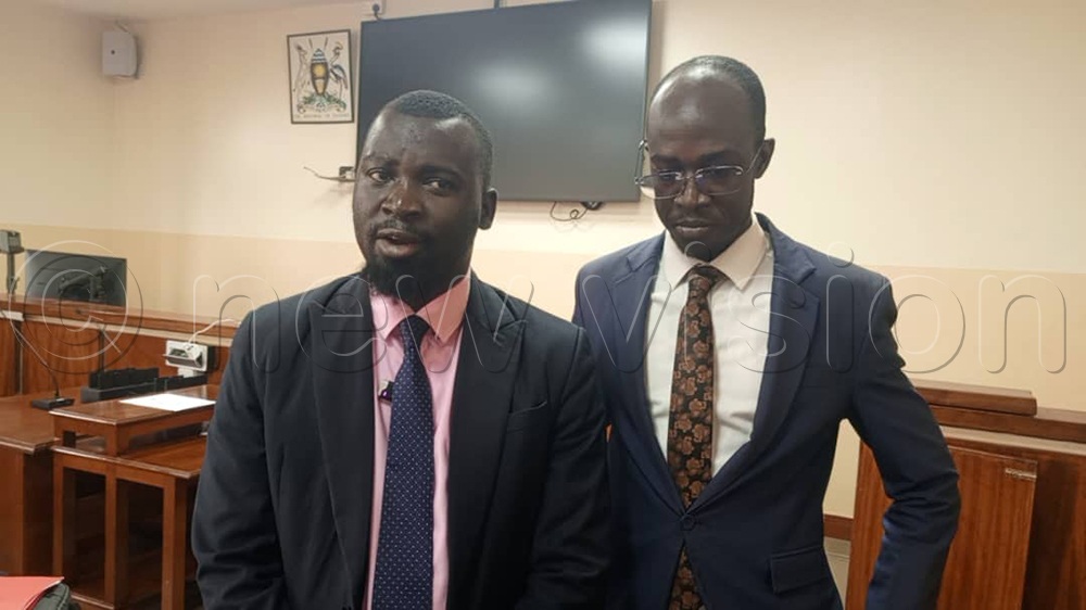 Salim Hadad, the NUP legal head together with lawyer his co-lawyer at Gulu  court. (Credit: Christopher Nyeko)