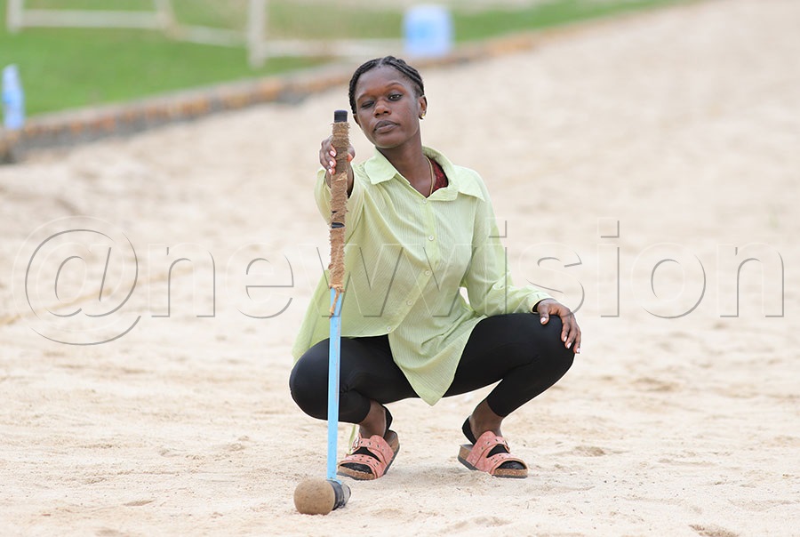 A woodball player during the National Beach Woodball Tournament in Bunjako