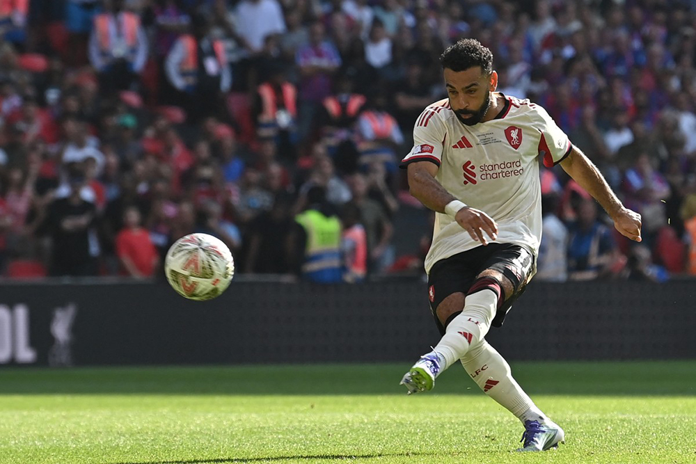 Liverpool's Egyptian striker #11 Mohamed Salah hits his penalty over the bar in the shoot-out during the English FA Community Shield football match between Crystal Palace and Liverpool at Wembley Stadium, in London on August 10, 2025. 