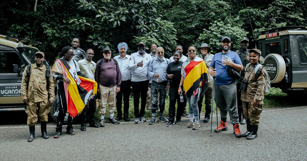 The group of Canadian influential tour operators and media personnel plus the officials from tourism ministry having a photo moment before tracking the chimpanzees in Kibale National Park. (Courtesy photo)