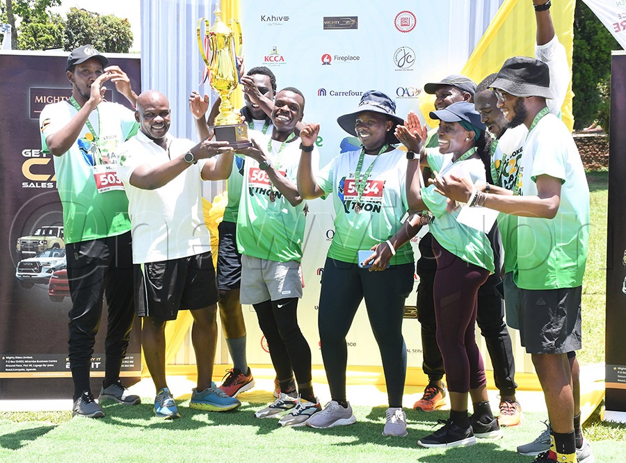 Team Deloitte Tax celebrate with the corporate relay trophy after the Matooke City to City Marathon in Entebbe. Photo by Michael Nsubuga