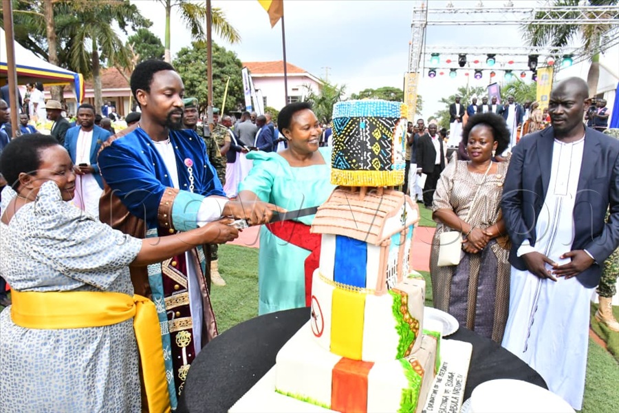 Kyabazinga William Gabula Nadiope IV, alongside Uganda's Prime Minister Robinah Nabbanja, and the Minister of the Presidency, Milly Babirye Babalanda cut cake during the commemoration of Kyabazinga's 11th coronation anniversary at Busoga Kingdom's headquarters at Bugembe in Jinja district.