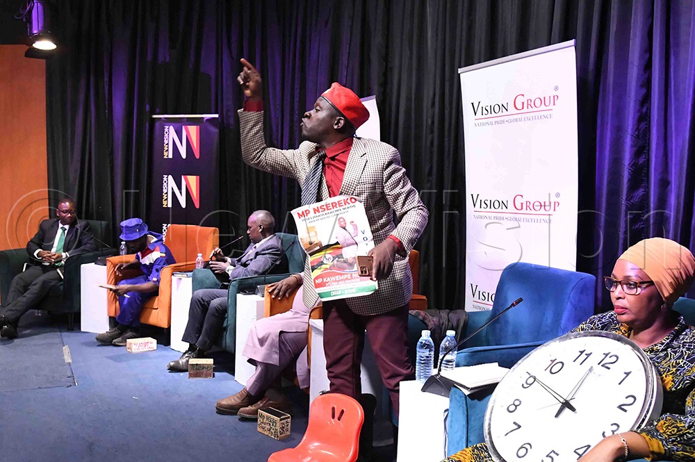 Nsereko responding to a candidate who asked why he was giving out boxes. (Credit: Eddie Ssejjoba)