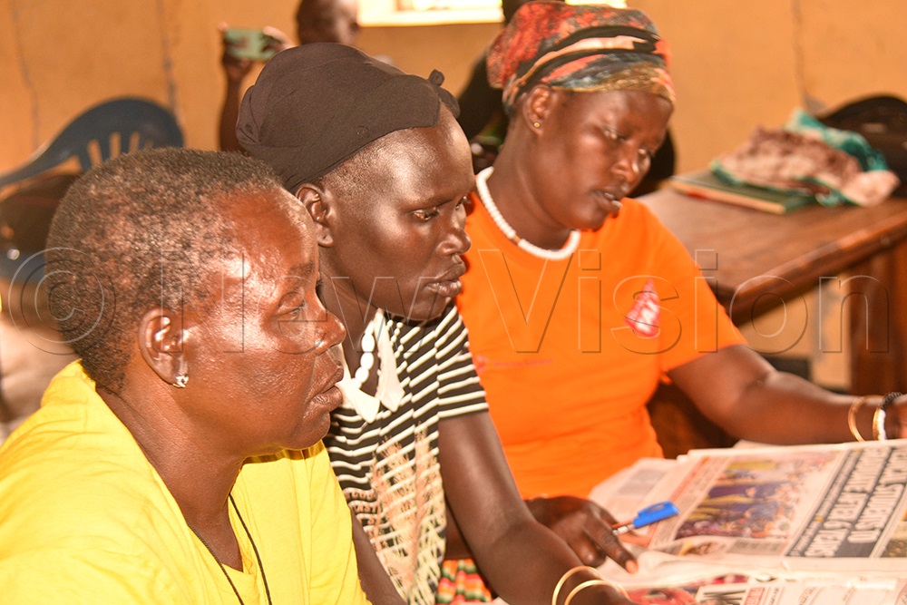 Sagal in the middle and fellow teachers going through the new vision and generating content they will use to teach pupils. (Credit: Jacky Achan)