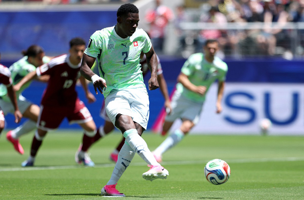 Breel Embolo #7 of Switzerland scores a penalty for his team's first goal during the FIFA World Cup 2026 Group B match between Qatar and Switzerland at San Francisco Bay Area Stadium on June 13, 2026 in San Francisco, California. (Photo by Emilee Chinn/Getty Images/AFP)