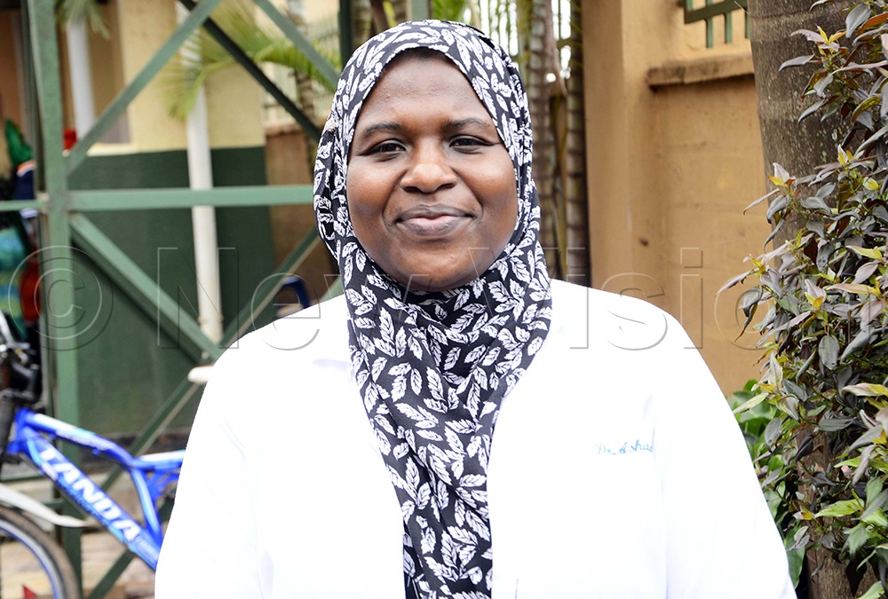 Dr Night Ashura, in charge of Kisugu health Centre iii at Namuwongo addressing journalists during the vaccination exercise at Kisugu Health Centre III at Namuwongo. (Photo by Juliet Kasirye)