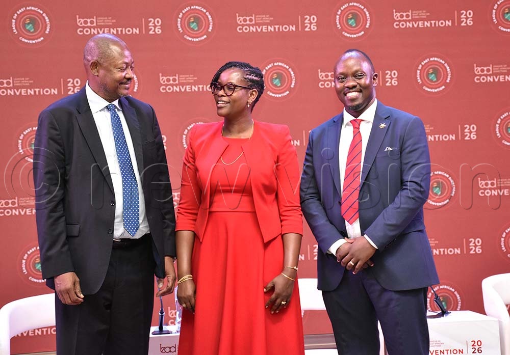Dr. Martin Oduor-Otieno interacting with Gertrude Karugaba chairperson League of East African Directors (LEAD) as Trevor Ariho, the Chief Executive Officer of LEAD looks on during the LEAD convention at Arirang Hotel. (Credit: Simon Peter Tumwine) 
