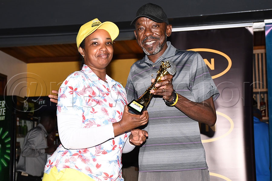 Group A winner Jovia Tugume (left) receives her trophy from MTN's Michael Sekadde after the MTN Monthly Tees tournament for the month of march at Entebbe Club, March 21, 2026. Photo by Michael Nsubuga