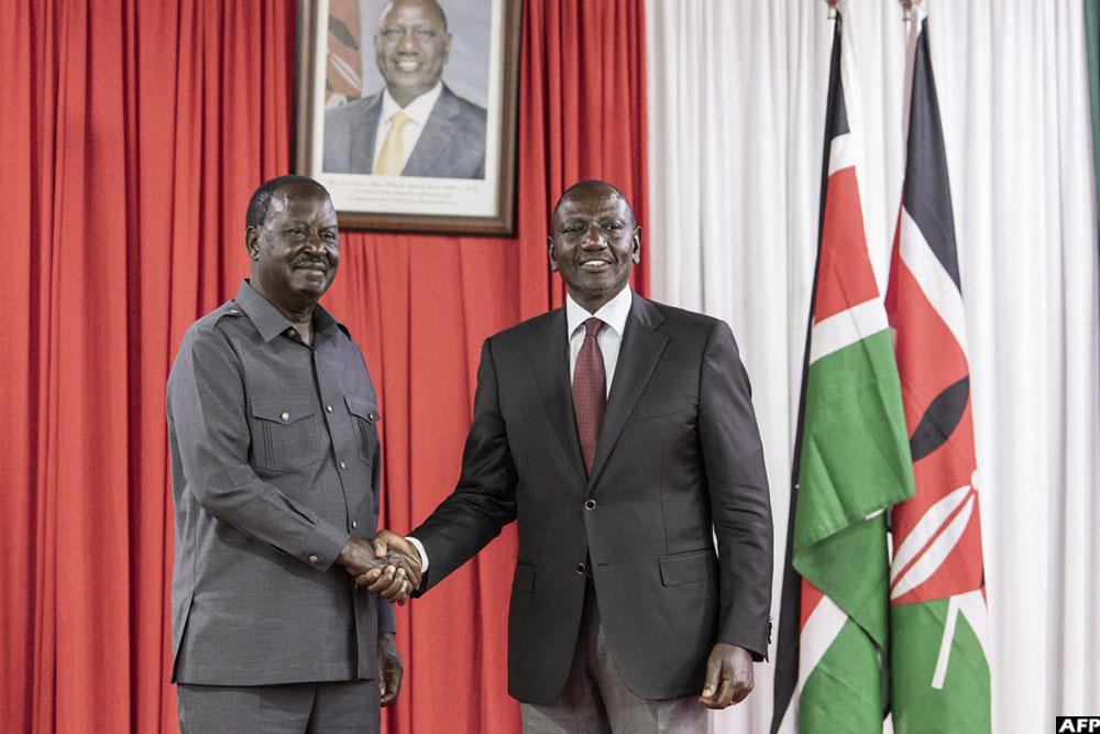 On March 7, 2025, Kenyan President William Ruto (R) shakes hands with former arch-rival and veteran politician Raila Odinga, after they officially signed a political cooperation deal in a bid to boost his presidency after months of turmoil, in Nairobi