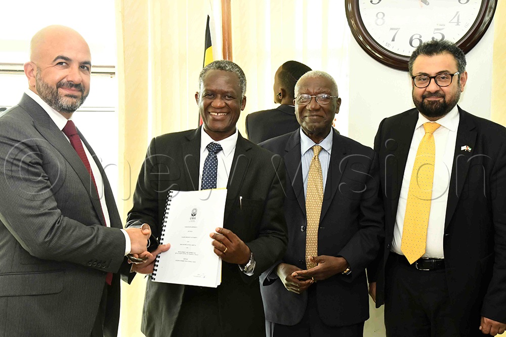 Eng. Hani Saliba (third left), the President of Haliburg Group exchaning MOU with Prof. James Kalema, the chairman board of trustees of Uganda Wildlife Authority (UWA) as the tourism minister, Tom Butime looks on. (Photo by Eddie Ssejjoba)