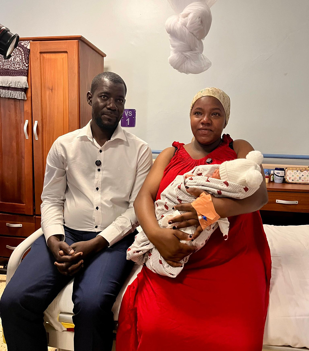 The baby girl, with her parents, born healthy and weighing 3.6 kilograms. (Courtesy photo)