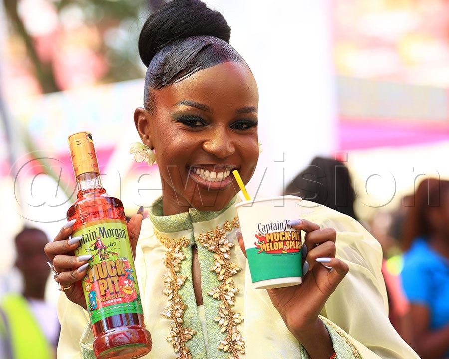 An influencer with a Captain Morgan Melon Splash bottle during its launch at UBL head offices in Luzira. Photo by Ignatius Kamya