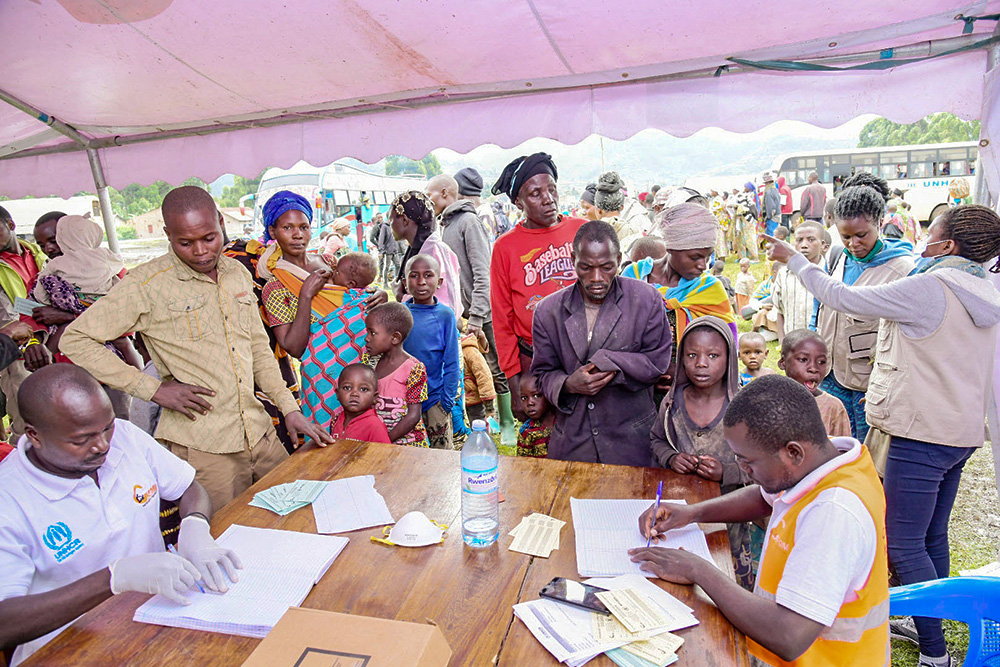 Congolese Refugees being registered at Nakibande transit camp on Wednesday, 30 March 2022 before they were transported to Nakivale settlement camp in Isingiro district. (Photo by Moses Nsubuga)